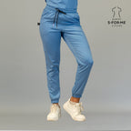 Close front view of women’s ceil blue Butter-Soft scrub joggers with slim fit