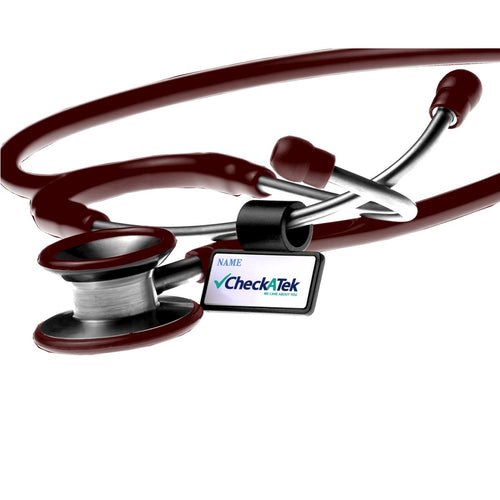 Burgundy cardiology stethoscope close-up showing dual stainless steel chestpiece and name tag